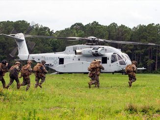 U.S. Marines with 1st Battalion, 2nd Marine Regiment prepare to board a CH-53K helicopter for an air assault training exercise at Marine Corps Base Camp Lejeune, North Carolina, June 10, 2021. Photo by Lance Cpl. Yuritzy Gomez.