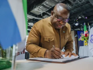 Sierra Leone President signs the guest book on the ship